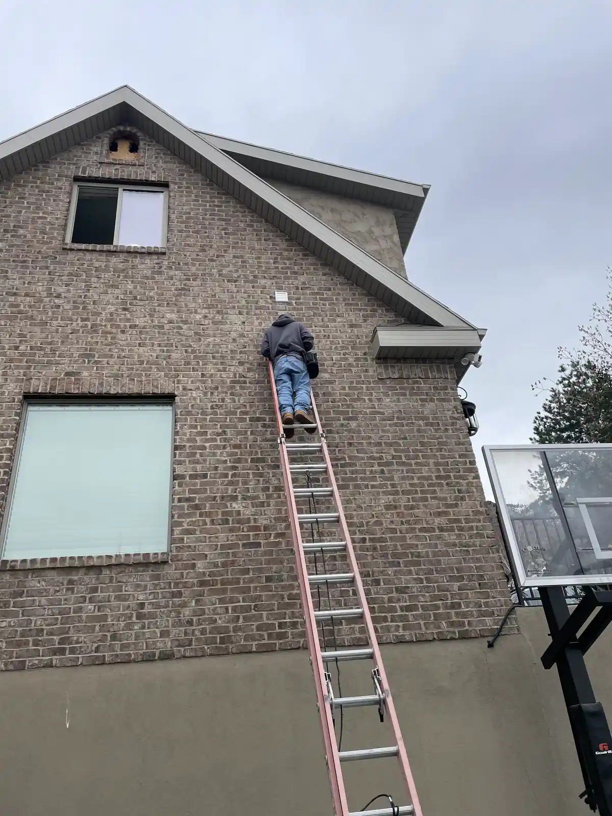 Technician Ladder Brick House provided by Air Pro UT.
