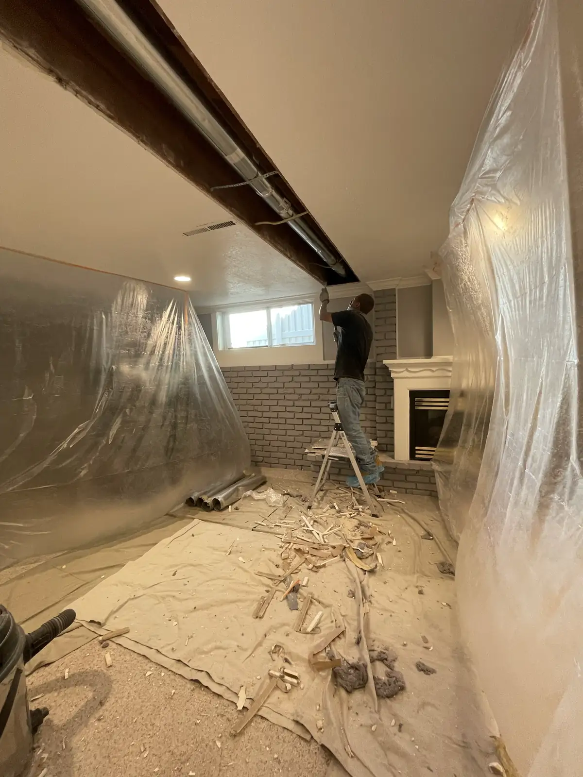 Basement Ceiling Cleanup Plastic Sheets provided by Air Pro UT.
