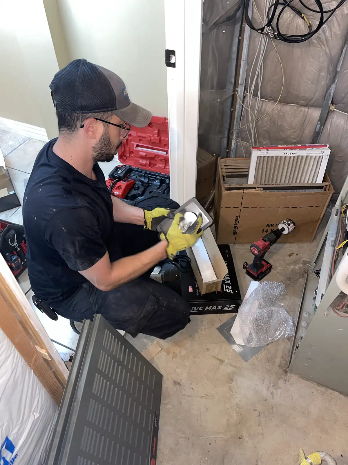 Technician Servicing Furnace Filter provided by Air Pro UT.